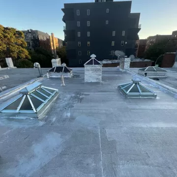 evening view of the roof to be repaired